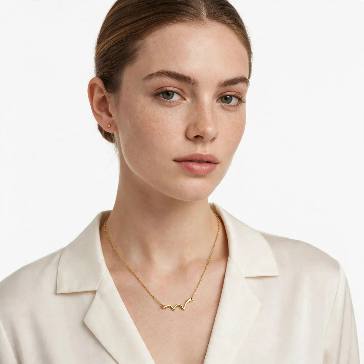 Model wearing the Marina Wave Pendant Necklace