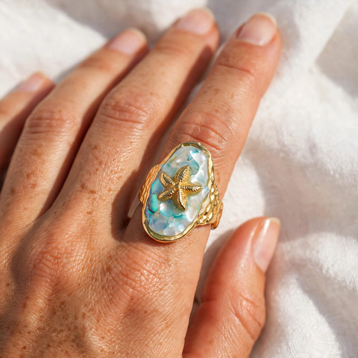 Maris Starfish Shell Open Ring worn on the hand